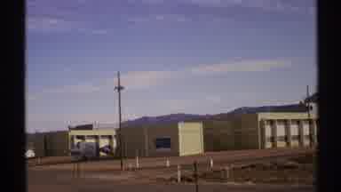 New Mexico-1972: Camera Captures Beige Building In Desert Landscape