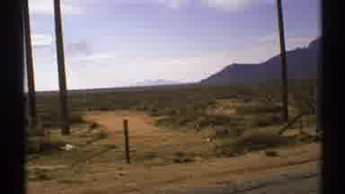 New Mexico (1972): The Mountains Look Pale In The Distance Compared To The Bright