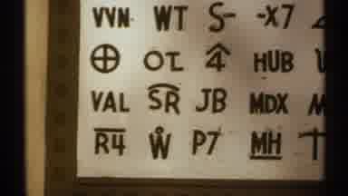 New Mexico (1972): View Of Black And White Symbol Sign Over Brown Wooden Double