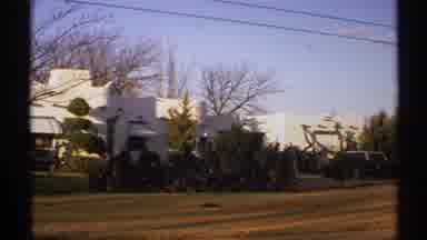 New Mexico (1972): Camera Captures The Details Of The White Building Surrounded By