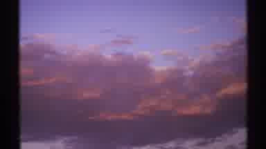 New Mexico (1972): The Camera Cuts From Sunset Colored Clouds To A Camp Tour Sign