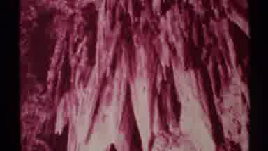 New Mexico (1972): Man Inside Red Cave As He Stands One Arm Up