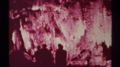 New Mexico (1972): Group Of Six Or So People Walking Around Pinkish Cave