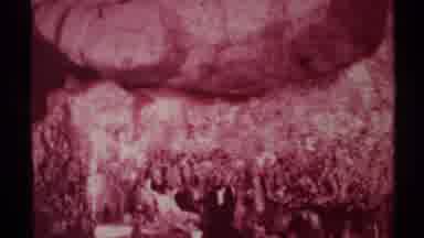 New Mexico (1972): People Walking Into Cave With View Of Stalagmites Inside The