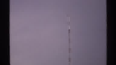 North Dakota (1972): Large Tower Reaching High Into The Sky With Clouds As A