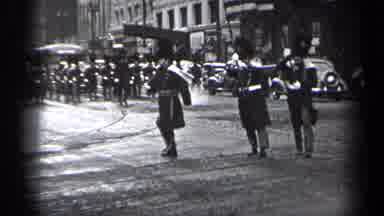 Cleveland Ohio (1937): Men In Uniforms Marching In The Street In The City