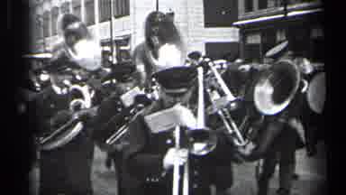 CLEVELAND OHIO-1937: Marching Band Playing Trombones Trumpets and Drums in City Parade