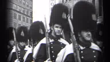 Cleveland Ohio (1937): Men Wearing Black Hats Marching Down Street On A Cloudy Day