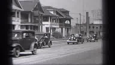 Cleveland Ohio (1937): Vintage Group Of Automobiles Driving Peacefully Down Open