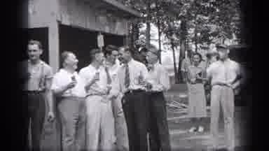 Cleveland Ohio (1937): Some Men Dressed In Suits Talking Around And Someone Takes