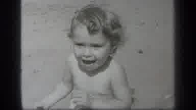 Cleveland Ohio (1938): A Toddler In Black And White Smiling And Showing Tongue To
