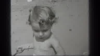 Cleveland Ohio (1938): A Baby Very Seriously Enjoys The Game Play Out There In The