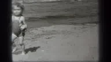 Cleveland Ohio (1938): Toddler Girl On Beach Walking Through Sand From The Water