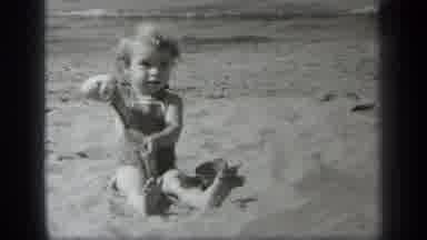 Cleveland Ohio (1938): Baby Sitting In The Sand With The Ocean In The Background