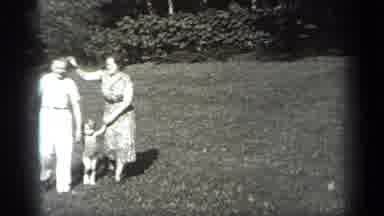 Cleveland Ohio (1938): Father And Mother Walking Their Child On The Garden