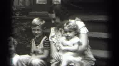 Cleveland Ohio (1938): Children Sitting With A Mother On Steps And A Woman Walking