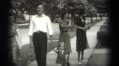 Cleveland Ohio (1938): Man Wearing White Shirt Walks With Toddler And Two Women