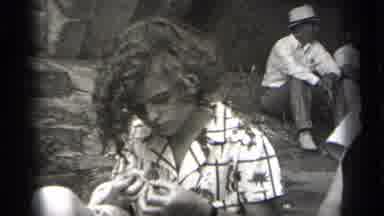 Cleveland Ohio (1938): Black And White Film Of A Young Woman Picking At Her