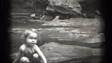 Cleveland Ohio (1938): A Child Sits On The Top Of The River And Enjoying The