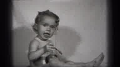 Cleveland Ohio (1938): Baby Makes Faces And Plays With Her Doll And Spoon