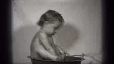 Cleveland Ohio (1938): Black And White Film Of A Young Child Bathing In A Small