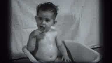Cleveland Ohio (1939): Baby Bathing In Bathtub Chewing On Something Looking Around