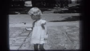 Cleveland Ohio (1939): Young Girl In A White Dress Walking Toward Camera With