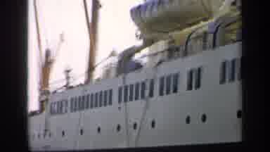 England (1949): Ship With Many Windows And Lifeboats Shot From The Dock On A Sunny