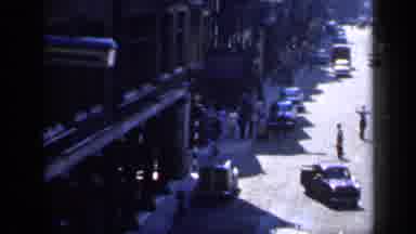 England (1949): Sunny Busy City Street With Traffic Pedestrians And Store Fronts