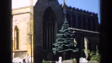 England (1949): A Christmas Tree Displayed In Front Of A Church