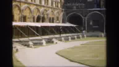 England (1949): Small Group Of People Wearing Black Climb Up Stone Stairs On A