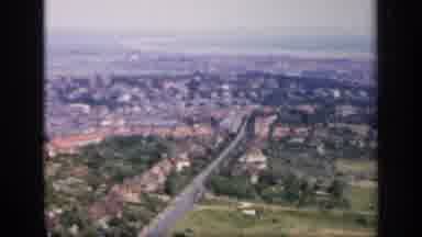 England (1949): Aerial View Of City And Farmland On A Sunny Day