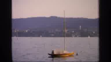 England (1949): The Boats Sit On The Calm Clear Water As Others Sail Through It