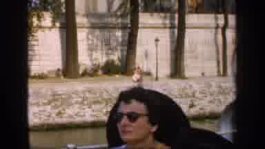 France (1949): People Sitting In A Boat Going Through Lake