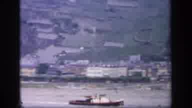 IRELAND-1949: Spectacular Riverside Town View With Boat And Terraced Hills