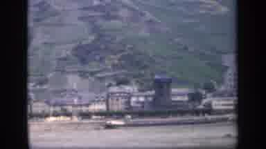 IRELAND-1949: Camera Pans Over Beautiful Hillside Town By The Water