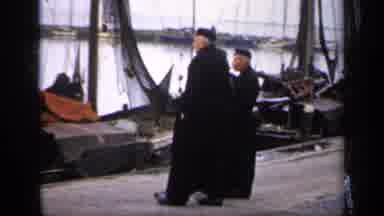 Ireland (1949): Four Men In Black Clothes Meeting At A Dock Together