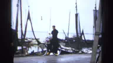 IRELAND-1949: Father And Child On Bicycle In Shipyard