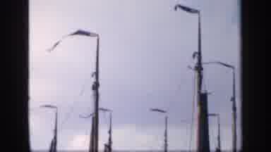 Ireland (1949): Furled Sails Of Six Sailboats On A Clear Windy Day