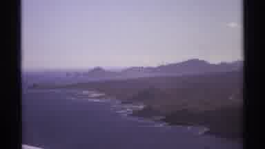 Cabo San Lucas Mexico (1974): Island With Ocean Surrounding It And Island Covered