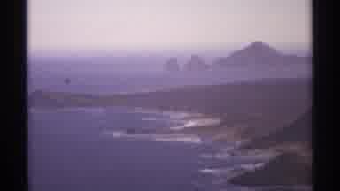 Cabo San Lucas Mexico (1974): The Shore Of An Island Filled With Green And Hills