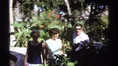 Cabo San Lucas Mexico (1974): Three People Walking By A Garden