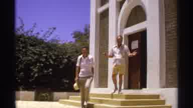 Cabo San Lucas Mexico (1974): Two Men Exit A Building And Walk Down Steps The