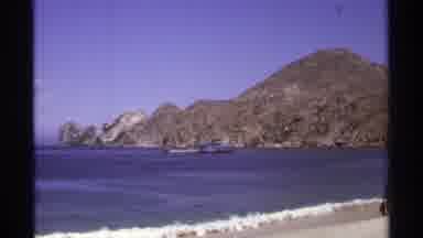 Cabo San Lucas Mexico (1974): Person Wearing Blue Shorts Walks To Beach Surf Water