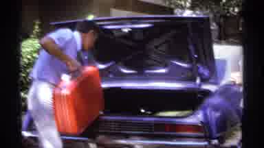 La Paz Mexico (1974): People Packing Their Luggage Putting It Behind A Car Trunk