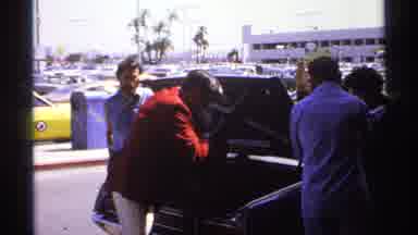 La Paz Mexico (1974): A Man Is Taking Luggage Out Of The Boot Of A Car