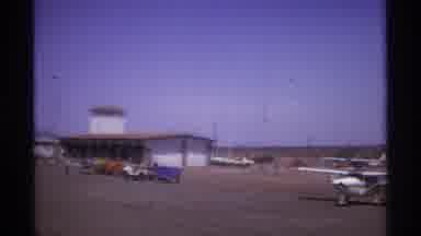 La Paz Mexico (1974): A Small Flight In A Take Off Place With Some Cars In The