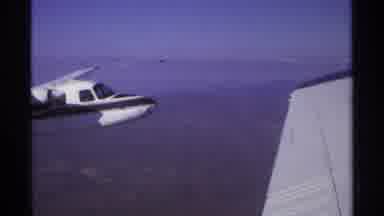 La Paz Mexico (1974): Airplane Sky Clouds Flying Mountains Earth Land Pilot White