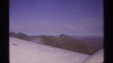 La Paz Mexico (1974): View From Inside A Plane Flying Over A Mountain Range