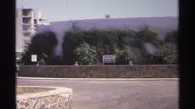 Guaymas Mexico (1975): A Man Drives The Car Slowly And Watches The Near Buildings